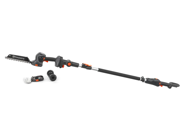Side view of a Husqvarna pole saw with interchangeable attachments on a white background.