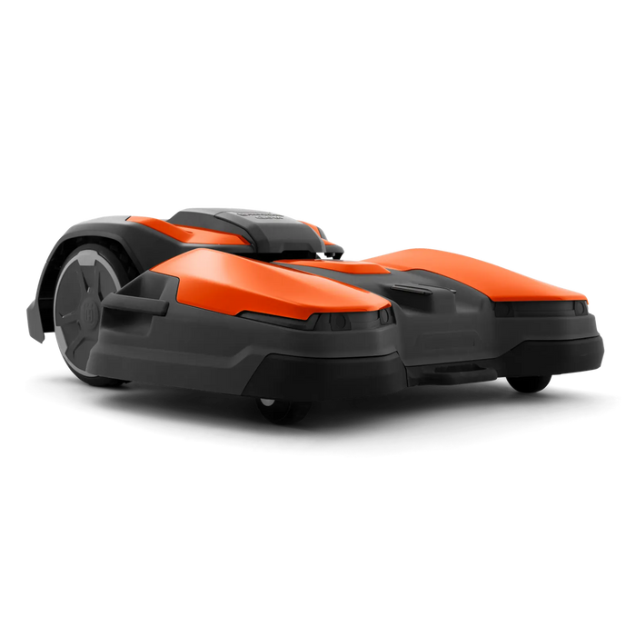 Side view of a Husqvarna robotic lawn mower designed for efficient garden maintenance.