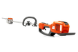 Side view of a Husqvarna battery-powered pole saw with ergonomic handle.
