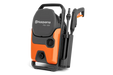 Front view of a Husqvarna PW 130 pressure washer with hose and nozzle attachments.