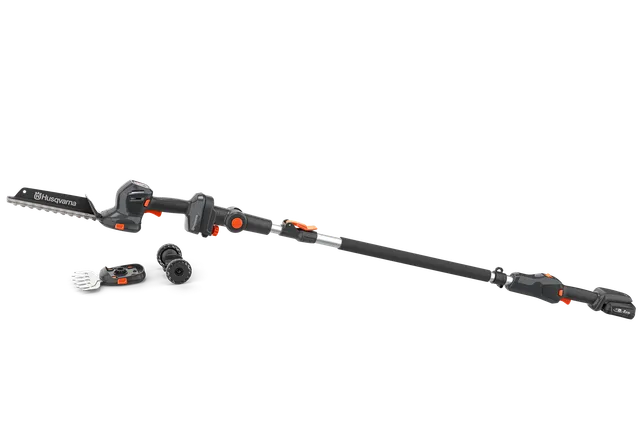 Side view of a Husqvarna telescopic pole saw with attachments, showcasing its design.