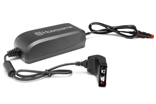 Front view of a Husqvarna battery charger with visible connectors.