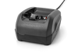 Front view of a Husqvarna battery charger with visible connection ports.