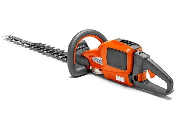Side view of a Husqvarna hedge trimmer with ergonomic handle and cutting blade.