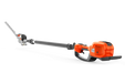 Side view of a Husqvarna battery-powered hedge trimmer with an extended reach.