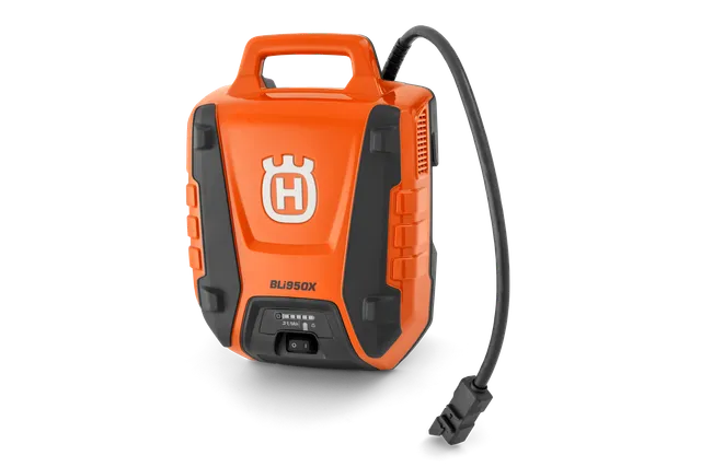 Front view of a Husqvarna BLi950X battery with power cable.