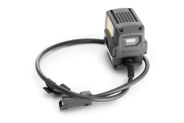 Front view of a Husqvarna battery adapter with a cable attached.