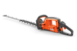 Side view of a Husqvarna hedge trimmer showcasing its ergonomic handle and cutting blade.