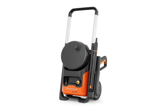 Front view of a Husqvarna pressure washer with wheels and hose reel.