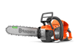 Side view of a Husqvarna chainsaw with visible chain and handle.