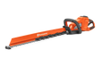Side view of a Husqvarna hedge trimmer with a long cutting blade.