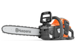 Side view of a Husqvarna chainsaw with ergonomic handle and visible branding.
