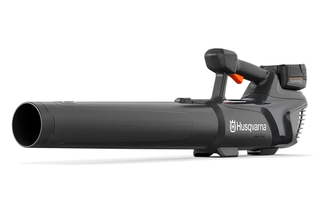 Side view of a Husqvarna handheld leaf blower with ergonomic handle.