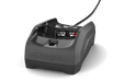 Front view of a Husqvarna battery charger with visible charging slots.