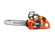 Side view of a Husqvarna chainsaw showcasing its ergonomic design.