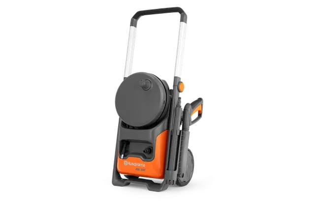 Front view of a Husqvarna pressure washer with wheels and hose reel.