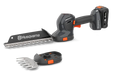 Side view of a Husqvarna battery-powered hedge trimmer with interchangeable blades.